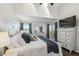 Primary bedroom features a vaulted ceiling, a balcony, and a light wood furniture set at 5537 Sea Forest Dr # 301, New Port Richey, FL 34652