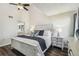 The spacious primary bedroom boasts dark floors, a vaulted ceiling, and an ensuite bathroom at 5537 Sea Forest Dr # 301, New Port Richey, FL 34652