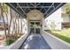 Inviting building entrance featuring a covered walkway and landscaped surroundings providing an exclusive welcome at 5537 Sea Forest Dr # 301, New Port Richey, FL 34652