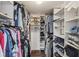 Walk-in closet with built-in shelving and hanging rods is ideal for organization and storage at 5537 Sea Forest Dr # 301, New Port Richey, FL 34652