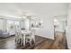 Cozy dining area adjacent to the kitchen, featuring a modern table and lots of natural light at 5537 Sea Forest Dr # 301, New Port Richey, FL 34652