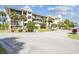 Attractive condo building exterior with balconies and greenery, illustrating a pleasant coastal residence at 5537 Sea Forest Dr # 301, New Port Richey, FL 34652