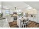 Charming kitchen showcasing a center island with seating, white cabinets, and stainless steel appliances at 5537 Sea Forest Dr # 301, New Port Richey, FL 34652