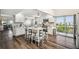 Bright, modern kitchen features white cabinets, granite countertops, island seating, and stainless appliances at 5537 Sea Forest Dr # 301, New Port Richey, FL 34652