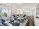 Open living room with modern furnishings, balcony access, and view of the kitchen at 5537 Sea Forest Dr # 301, New Port Richey, FL 34652
