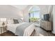 Bright main bedroom featuring a balcony, vaulted ceilings, and wood-look floors at 5537 Sea Forest Dr # 301, New Port Richey, FL 34652