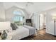 Bright main bedroom with vaulted ceilings, balcony access, and ensuite bathroom at 5537 Sea Forest Dr # 301, New Port Richey, FL 34652