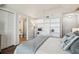 Bright main bedroom with vaulted ceilings, ensuite bathroom, and built in shelves at 5537 Sea Forest Dr # 301, New Port Richey, FL 34652