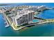 Aerial view of the condo and the pool with views of the water at 6035 Sea Ranch Dr # 305, Hudson, FL 34667