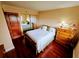 Bedroom featuring a bed, dresser and mirrored closet doors at 6035 Sea Ranch Dr # 305, Hudson, FL 34667