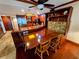 Well-lit kitchen with stainless steel appliances and adjacent dining area with seating at 6035 Sea Ranch Dr # 305, Hudson, FL 34667