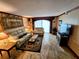 Comfortable living room with travertine floors and sliding glass doors for natural light at 6035 Sea Ranch Dr # 305, Hudson, FL 34667