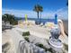 Spacious waterfront patio area perfect for relaxation and entertaining, complete with lounge chairs and decorative pelican at 6035 Sea Ranch Dr # 305, Hudson, FL 34667