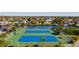 Aerial view of tennis courts with community waterfront access and stunning views at 6035 Sea Ranch Dr # 305, Hudson, FL 34667