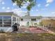 Enjoy the backyard space with the grill, chairs and landscaping at 6422 Tralee Ave, New Port Richey, FL 34653