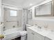 Bright bathroom featuring a shower-tub combination and a single vanity at 6422 Tralee Ave, New Port Richey, FL 34653