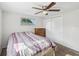 This bedroom has carpet flooring, ceiling fan and closet at 6422 Tralee Ave, New Port Richey, FL 34653