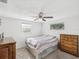 Bedroom featuring neutral paint, a ceiling fan, and natural light at 6422 Tralee Ave, New Port Richey, FL 34653