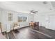 Bright dining room featuring hard floors, ceiling fan, and neutral paint at 6422 Tralee Ave, New Port Richey, FL 34653