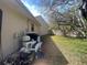 View of the backyard with the pool equipment and fencing at 6475 Laurel Oak Dr, Spring Hill, FL 34607