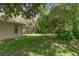 Spacious backyard with mature trees and green grass at 6475 Laurel Oak Dr, Spring Hill, FL 34607