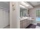 Bathroom featuring a shower, toilet, and door leading to the pool and outdoor area at 6475 Laurel Oak Dr, Spring Hill, FL 34607