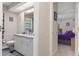Bathroom with a large vanity, lots of storage, and an adjacent bedroom at 6475 Laurel Oak Dr, Spring Hill, FL 34607