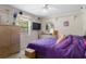 Cozy bedroom with ceiling fan, shelving, window, and a comfortable bed at 6475 Laurel Oak Dr, Spring Hill, FL 34607