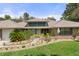 Inviting home exterior with lush landscaping and a charming brick walkway at 6475 Laurel Oak Dr, Spring Hill, FL 34607