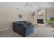 Inviting living room with vaulted ceiling, fireplace, and comfortable seating arrangement at 6475 Laurel Oak Dr, Spring Hill, FL 34607