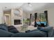 Cozy living area featuring fireplace, pool views, and comfortable seating perfect for relaxing at 6475 Laurel Oak Dr, Spring Hill, FL 34607