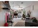 Spacious living room featuring a ceiling fan, a sofa, and a large television at 6475 Laurel Oak Dr, Spring Hill, FL 34607