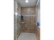 Walk-in shower with tiled surround and multiple shower heads and fixtures at 6475 Laurel Oak Dr, Spring Hill, FL 34607