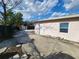Backyard with a storage shed, partial fence and concrete floor at 6819 Treehaven Dr, Spring Hill, FL 34606