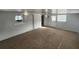 Spacious finished basement area with neutral carpet and good natural light at 6819 Treehaven Dr, Spring Hill, FL 34606