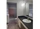 Bathroom featuring a vanity with sink, toilet and shower/tub combination with sliding door at 6819 Treehaven Dr, Spring Hill, FL 34606
