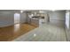 Open-concept living space with tile flooring, a breakfast bar, and plenty of natural light at 6819 Treehaven Dr, Spring Hill, FL 34606