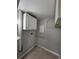 Utility room featuring overhead storage cabinets and a utility sink at 6819 Treehaven Dr, Spring Hill, FL 34606
