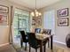 Bright dining area with sophisticated decor and outdoor views through sliding glass door at 6821 Breezy Palm Dr, Riverview, FL 33578