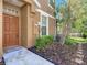 Inviting front entrance featuring a well-kept garden and walkway leading to the front door at 6821 Breezy Palm Dr, Riverview, FL 33578