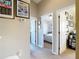 Hallway view featuring neutral walls with carpet and framed posters at 6821 Breezy Palm Dr, Riverview, FL 33578