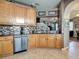 Stylish kitchen featuring stainless steel appliances and a view of the living room at 6821 Breezy Palm Dr, Riverview, FL 33578