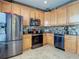 Beautiful kitchen featuring stainless steel appliances, ample cabinet space, and stylish backsplash at 6821 Breezy Palm Dr, Riverview, FL 33578