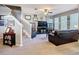 Inviting living room with neutral walls, staircase and view of the front windows at 6821 Breezy Palm Dr, Riverview, FL 33578