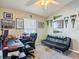 Home office featuring neutral walls, a leather chair, a futon, and a ceiling fan at 6821 Breezy Palm Dr, Riverview, FL 33578