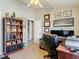Home office featuring neutral walls, built-in bookshelves, and a leather chair at 6821 Breezy Palm Dr, Riverview, FL 33578