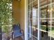 Inviting patio with a chair and garden view, offering a serene spot for relaxation at 6821 Breezy Palm Dr, Riverview, FL 33578