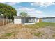 Spacious backyard with a screened patio, ideal for outdoor enjoyment and entertaining at 7034 N King Arthur E Dr # 4, Port Richey, FL 34668
