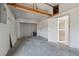 Unfinished basement area featuring an open ceiling and concrete floor at 7034 N King Arthur E Dr # 4, Port Richey, FL 34668