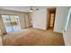 Bedroom with sliding glass doors that open to the sunroom offering plenty of natural light at 7495 Heather Walk Dr, Weeki Wachee, FL 34613